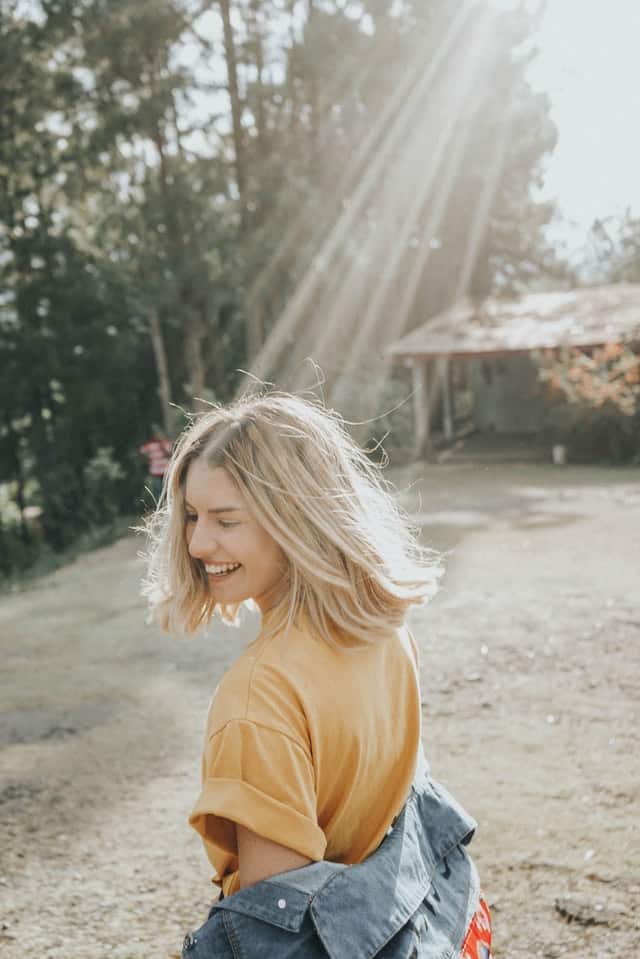 happy woman in her 20s after realizing she has so much more to live than feeling lost